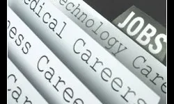Job Search Assistance Close-up of categorized job listings, including technology, medical, and business careers, with the word "JOBS" visible.