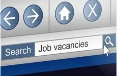 Online Posting A computer screen shows a search bar with "Job vacancies" typed in and a cursor over the search icon.